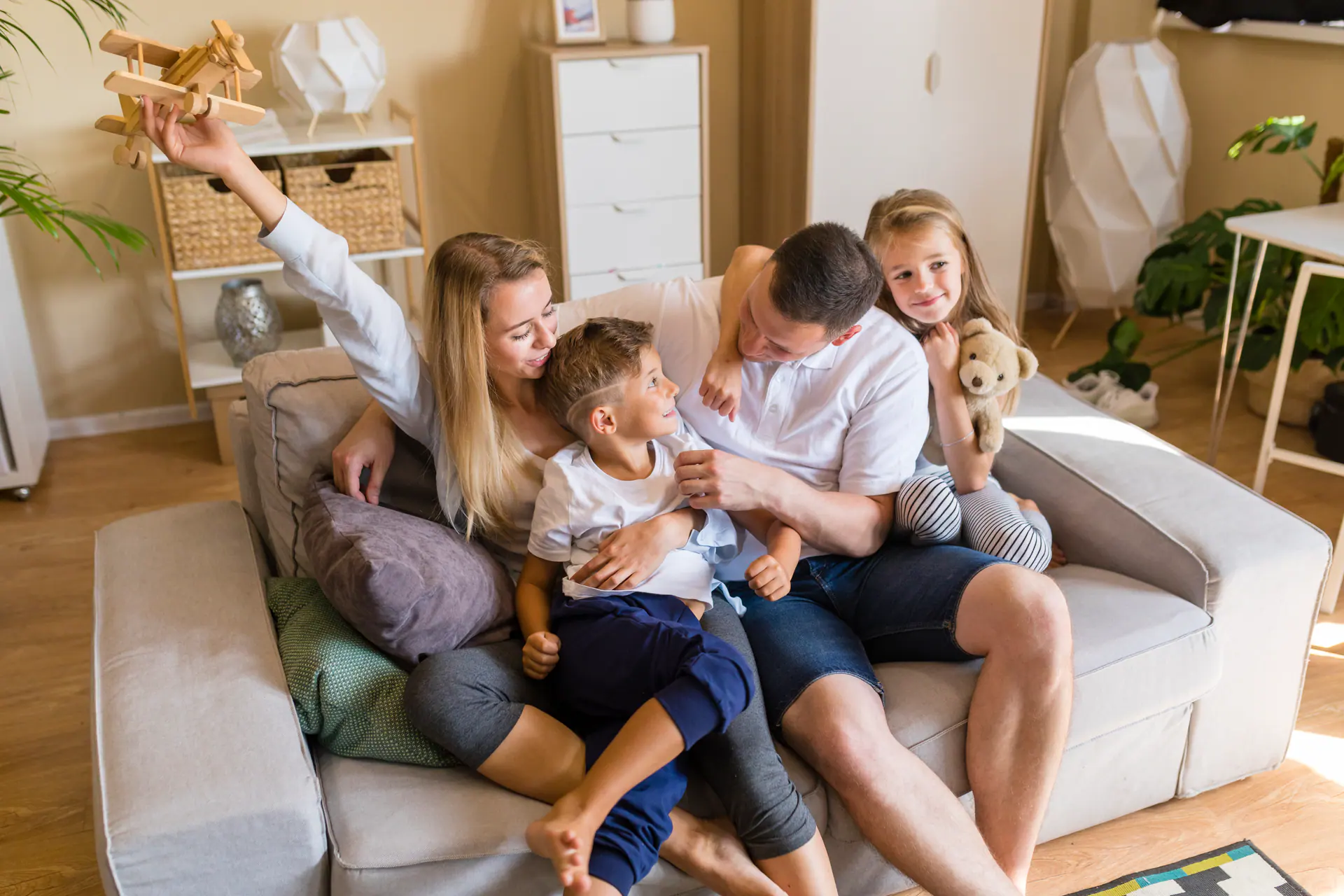 Family Playing Living Room With Toys