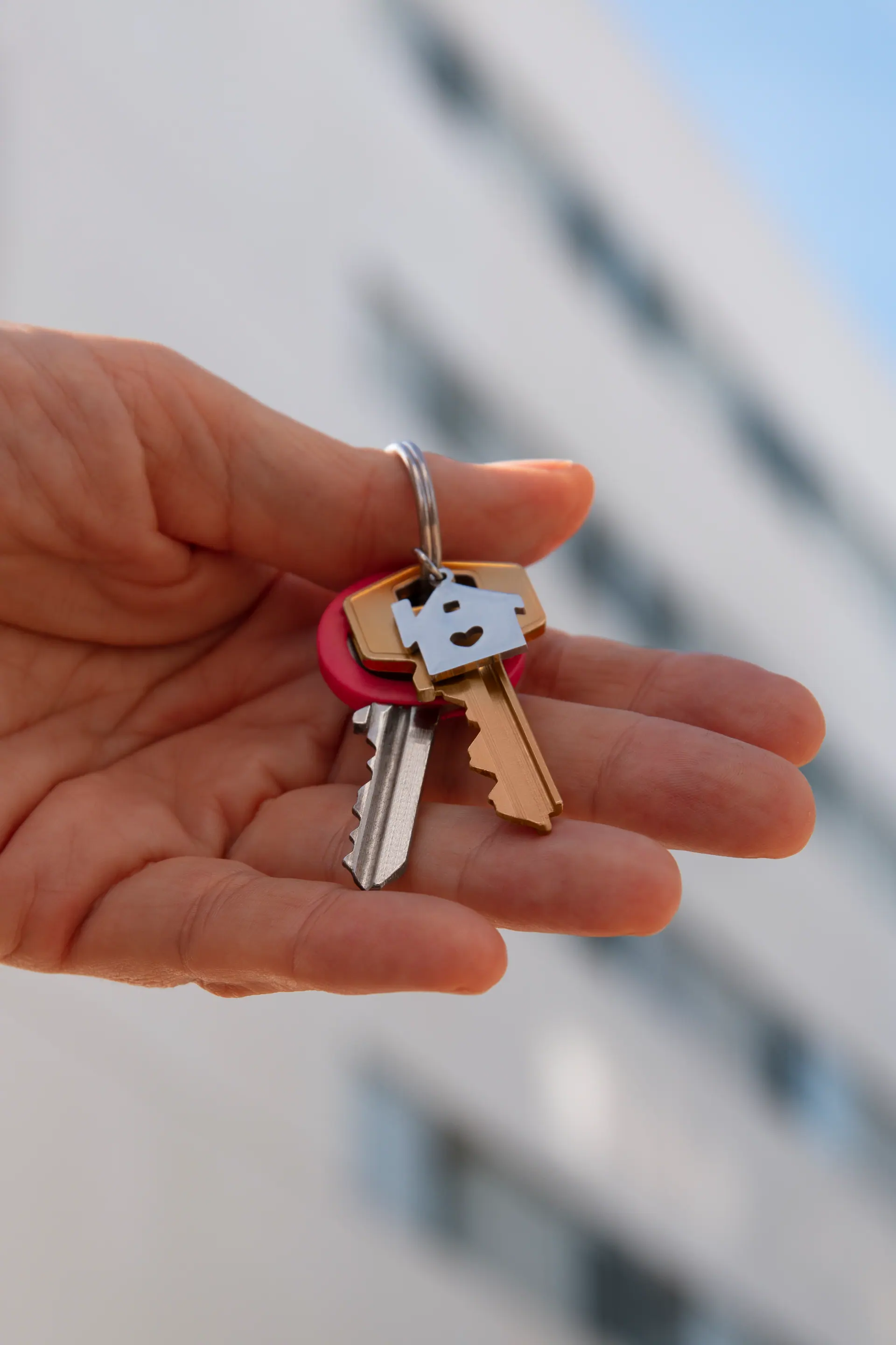 A person holding apartment keys